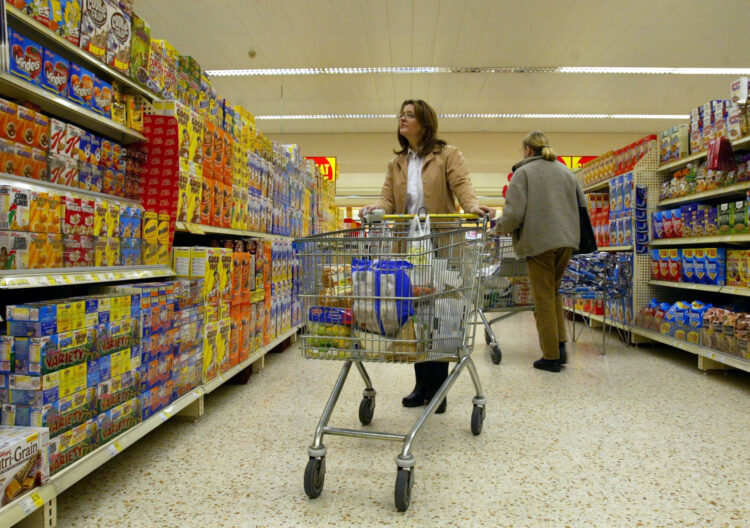 File photo dated 13/01/03 of shoppers in a Morrison's Supermarket in Winsford, Cheshire. Consumers have seen the price of hundreds of popular grocery items rise by more than 20% over the last two years alongside a drop in supermarket discounts and budget ranges, a study has found. Issue date: Saturday May 21, 2022.